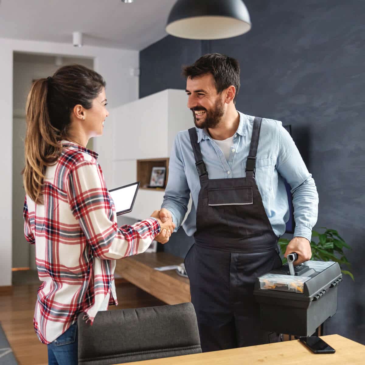 Customers thank SwiftPro technician for HVAC service in McLean, VA.