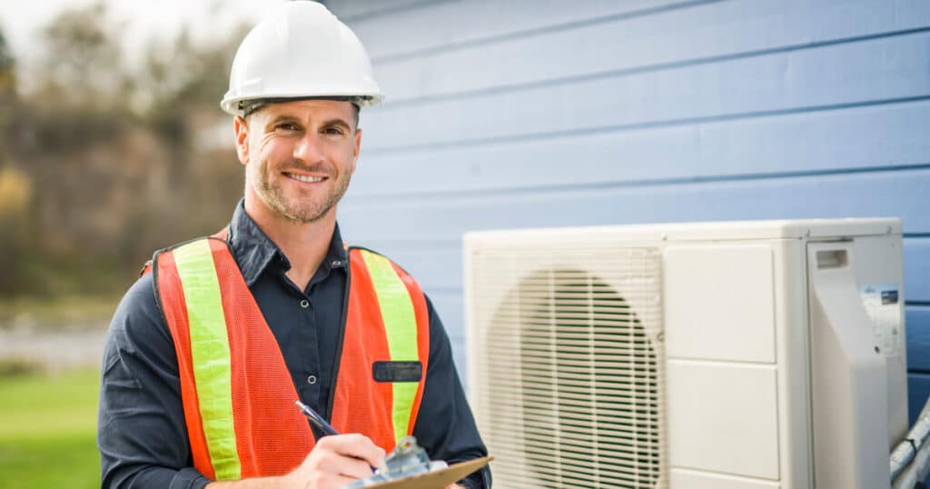 HVAC contractor inspecting air conditioning unit, Northern Virginia home comfort expert.