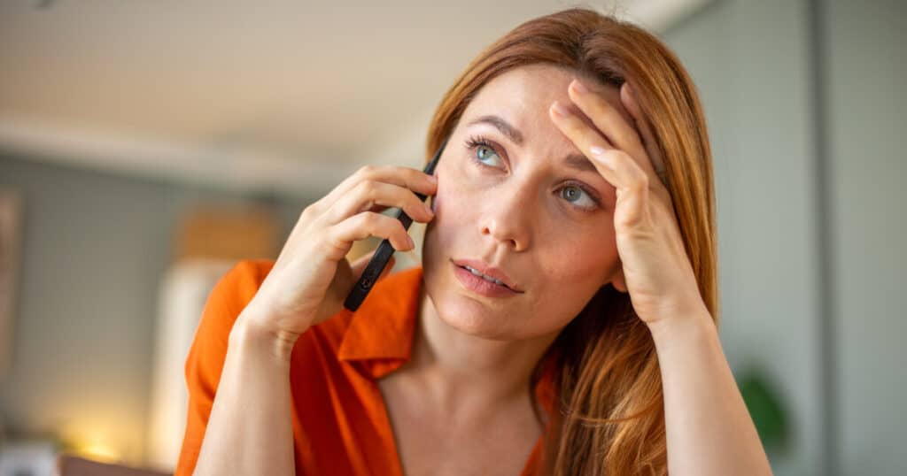 Concerned homeowner on phone, signs of AC repair needed, SwiftPro Northern Virginia.