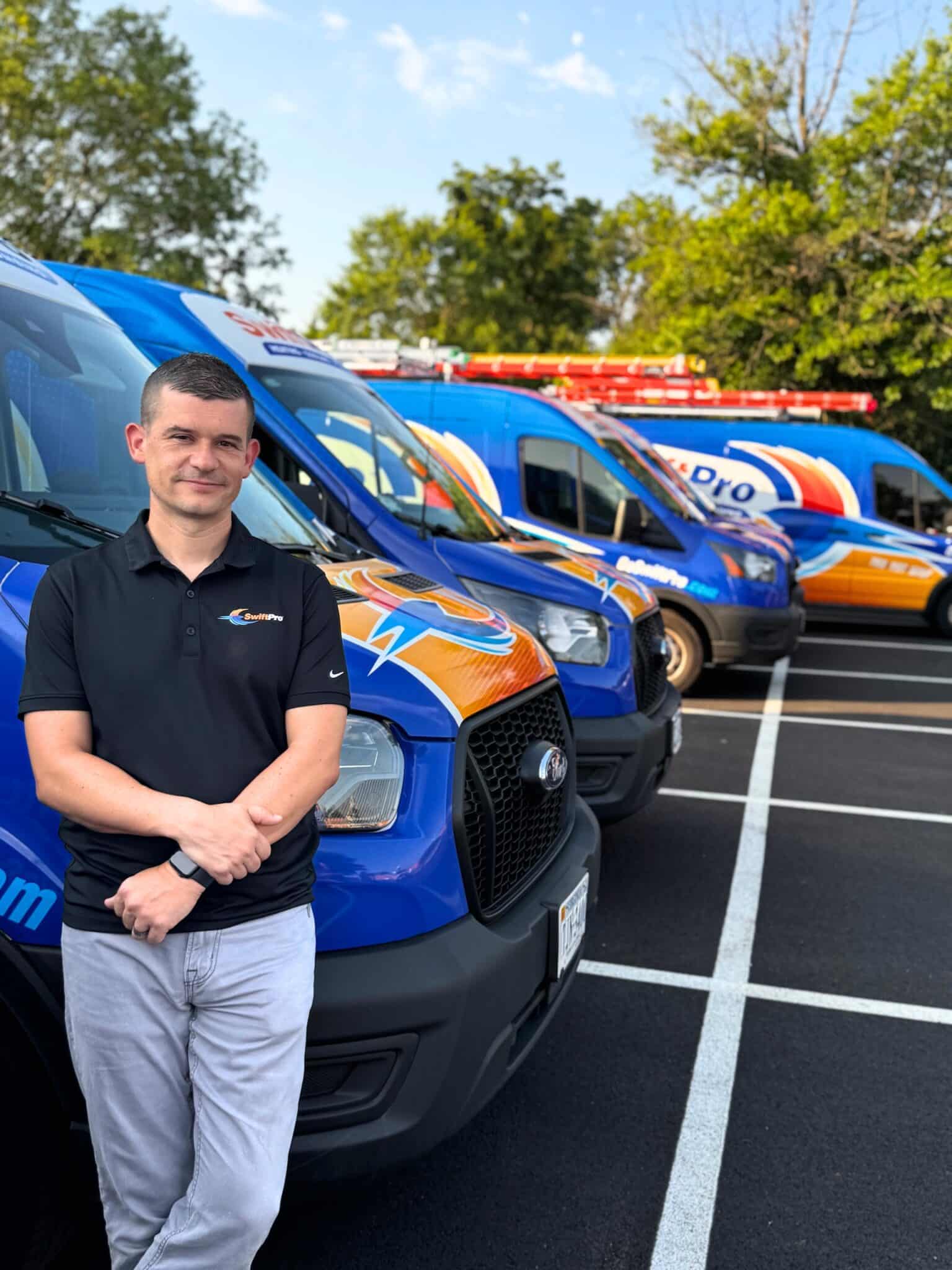 SwiftPro technician and company vans in Northern Virginia, offering plumbing and HVAC services.