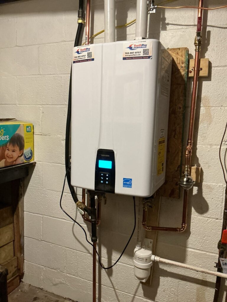 A wall-mounted tankless water heater installed by SwiftPro in a Northern Virginia home