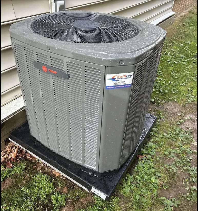 A new Trane condenser installed by SwiftPro on a level pad beside a Northern Virginia home
