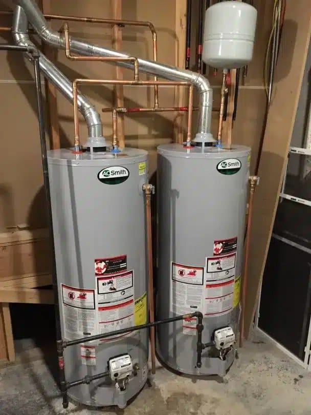 Two gas tank water heaters side by side with an expansion tank in a Northern Virginia home