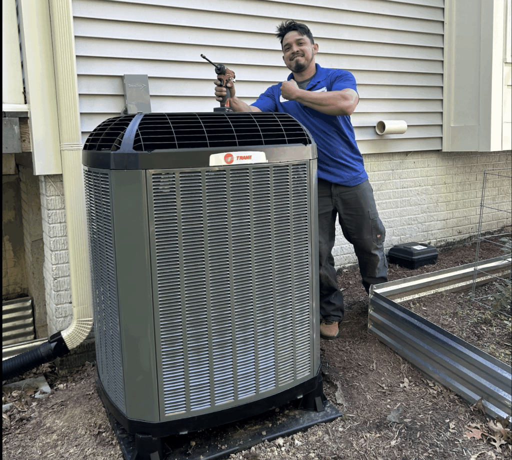 A SwiftPro technician servicing an outdoor air conditioning condenser at a Northern Virginia home