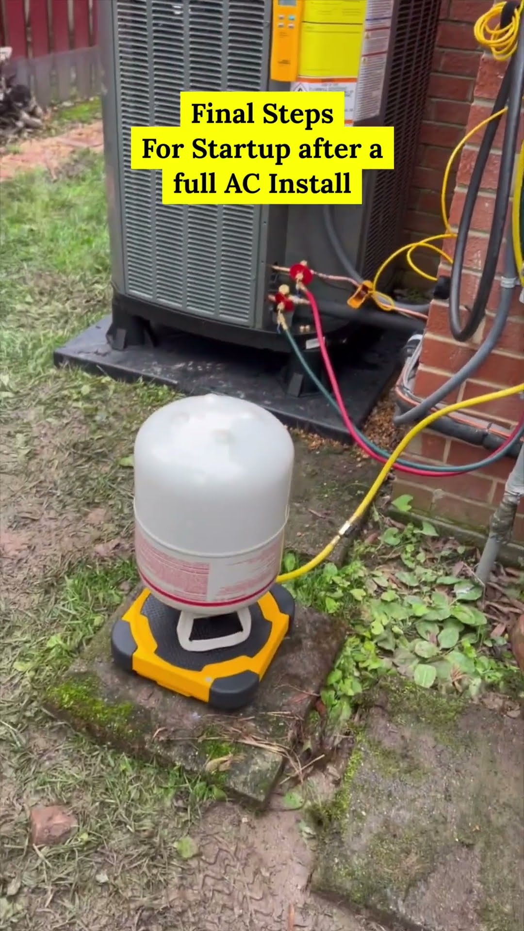 Startup steps after a full AC install: a new Trane condenser against a brick wall, a refrigerant cylinder on a digital scale with hoses to the service valves, and a Fieldpiece digital manifold reading